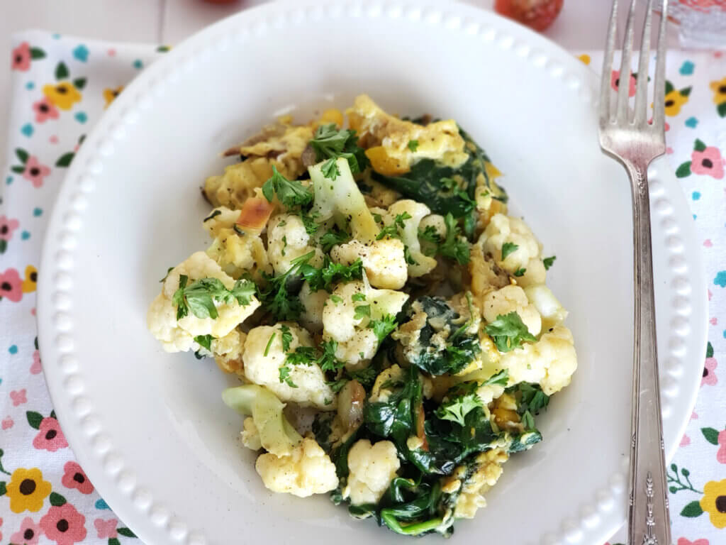 renal diet breakfast dish for loaded veggie eggs on striped cloth