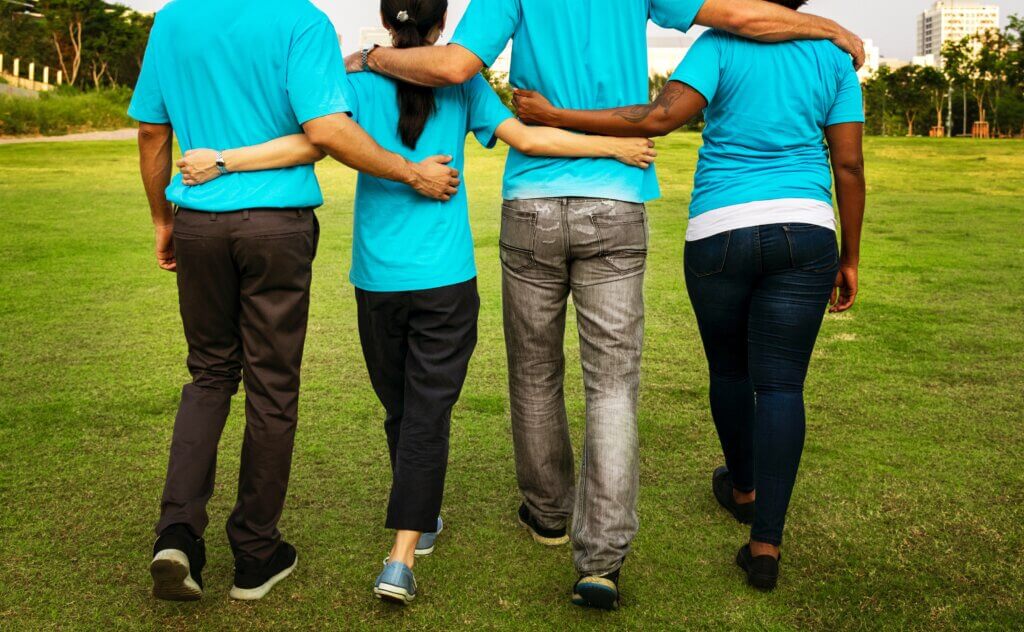 cooperative people in blue shirts as example of how probiotics for kidneys are linked with the gut