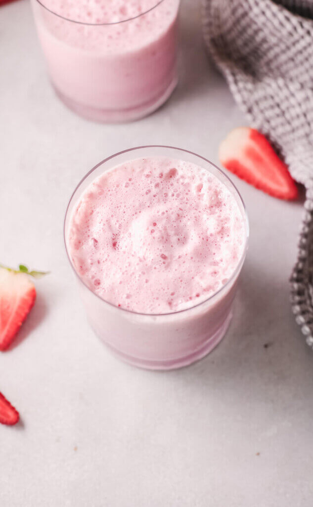 Berry yogurt smoothie close up with strawberries