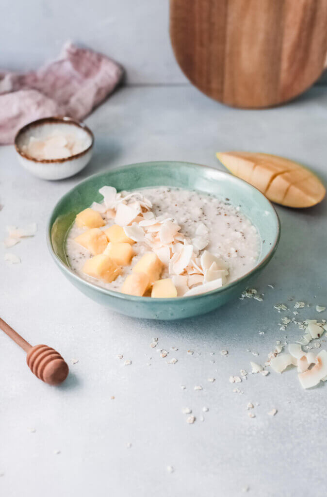 Tropical coconut oatmeal with mango, coconut and almonds.
