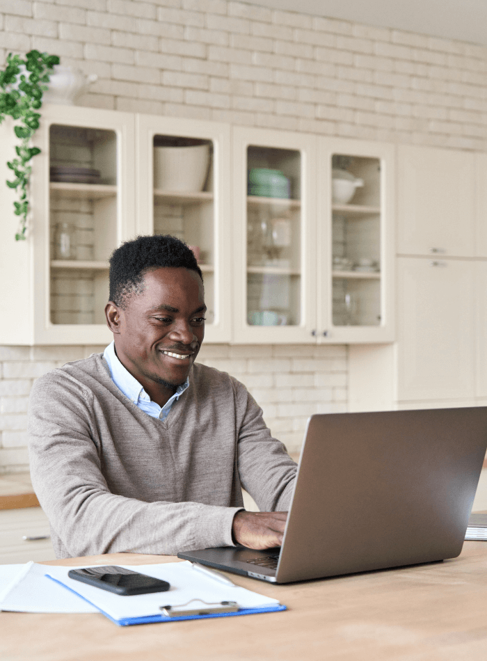 African American man on a laptop computer joining the Kidney Health Community for CKD or PKD