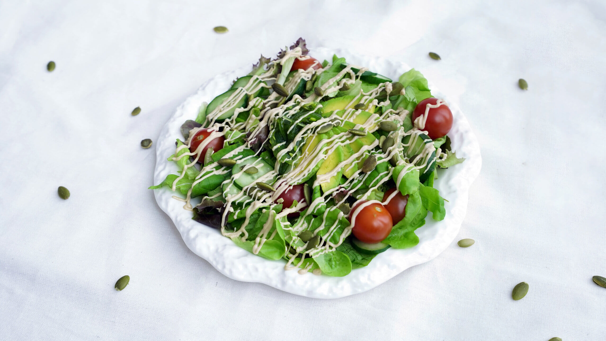 Sesame Salad with sesame dressing drizzled on top