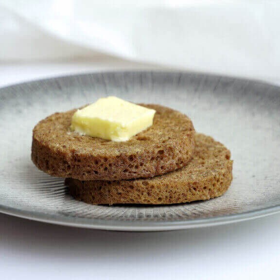 KNI's 90-Second Keto Bread stacked with butter on top